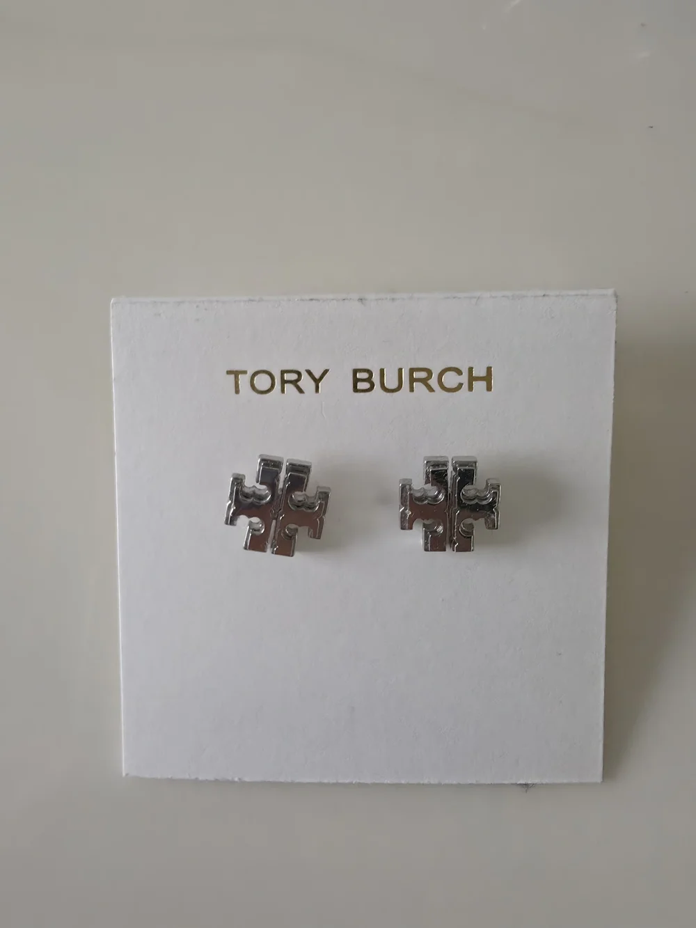 Tory Burch Silver Logo Stud Earrings - Pink Accent Display